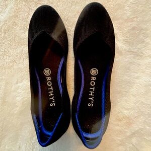 Black round toe Rothy’s flats, size 8